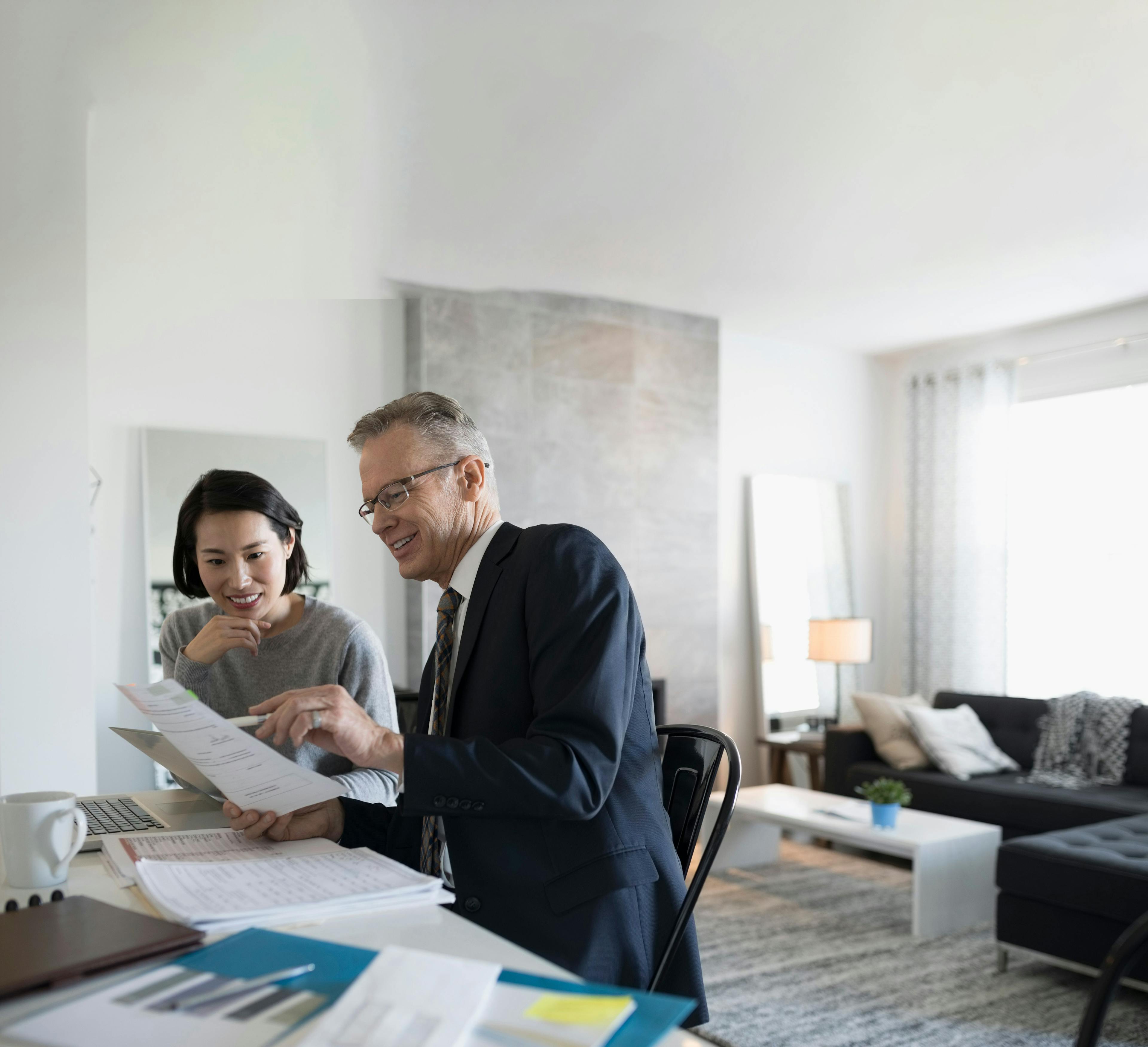 Man showing woman papers